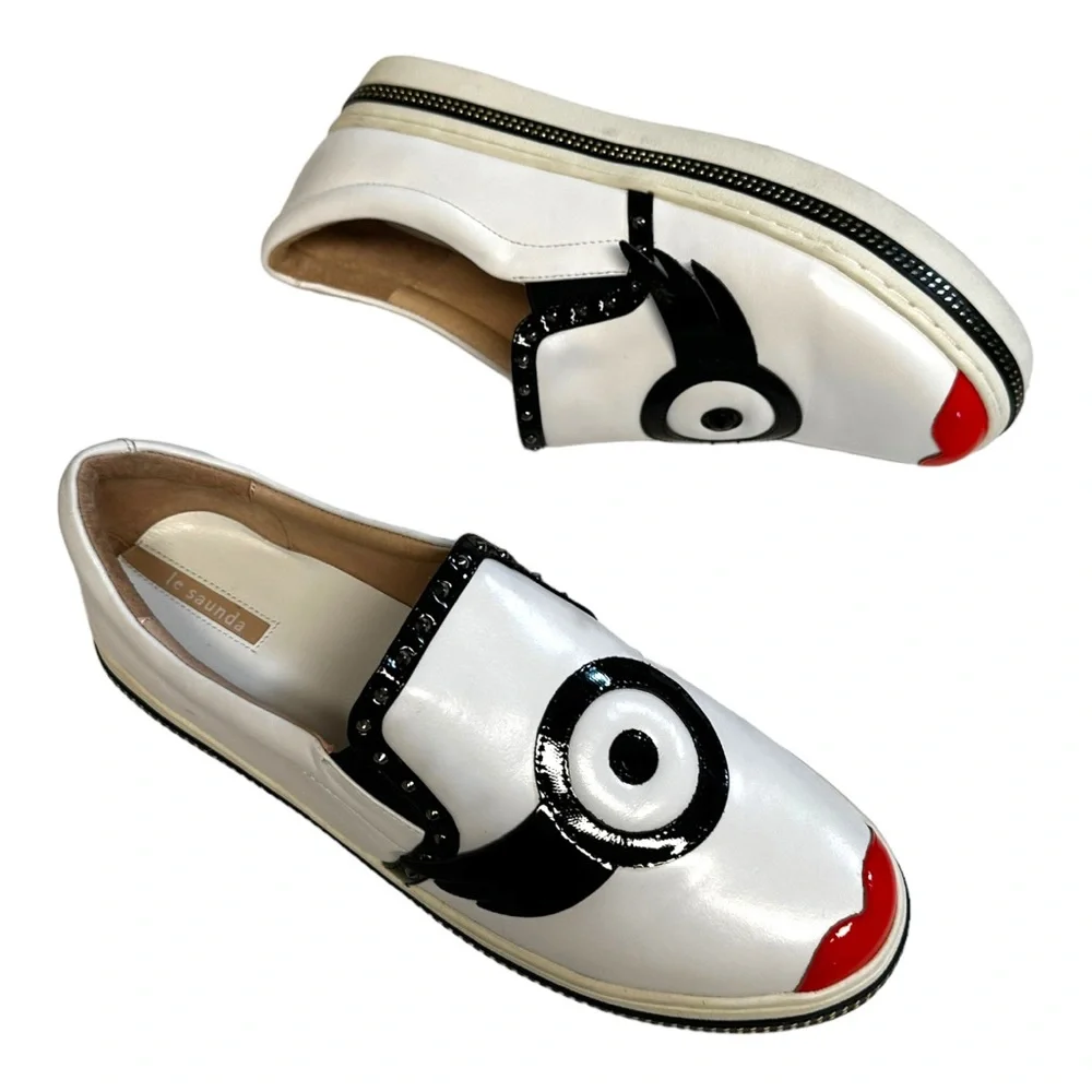White Leather Slip-On Sneakers with Black Trim and Red Accent